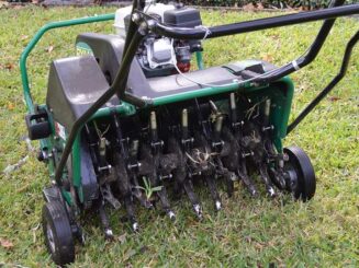 lawn-aerator-og Green landscape edger for lawn trimming and garden edging services.